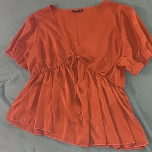 rust color blouse